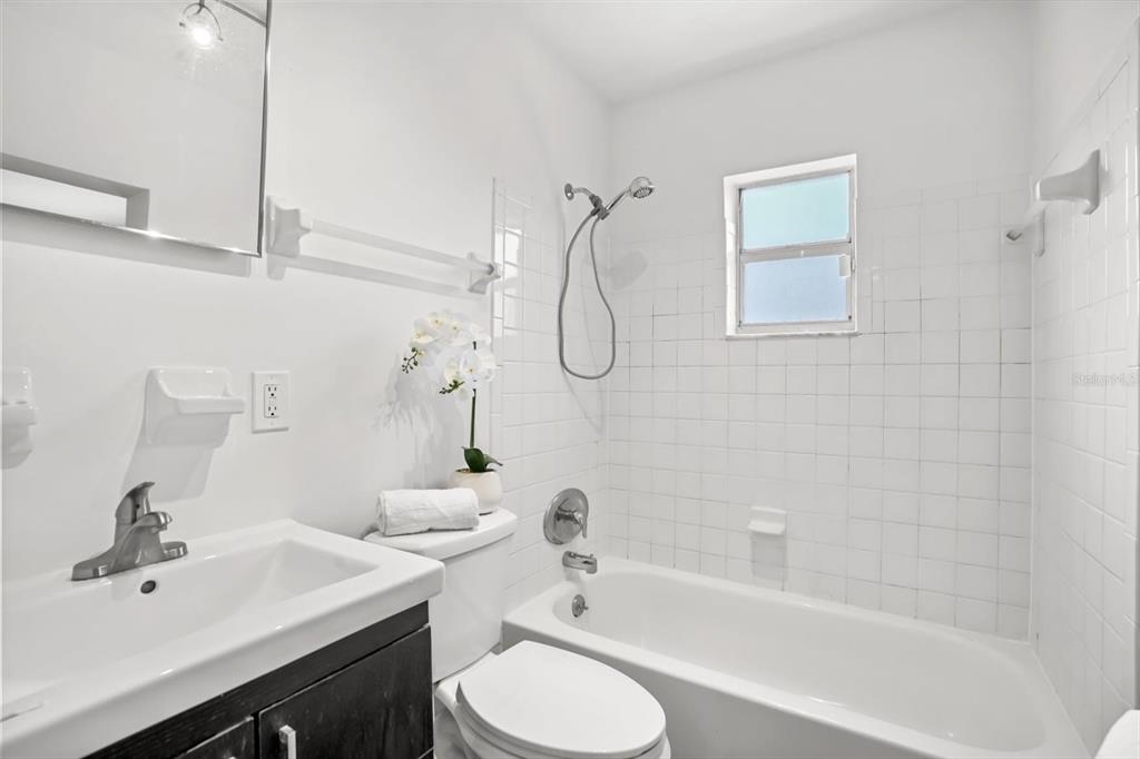 720 West Webster Avenue Winter Park, FL 32789 - Photo 12 of 22 a bathroom with a sink a toilet and shower