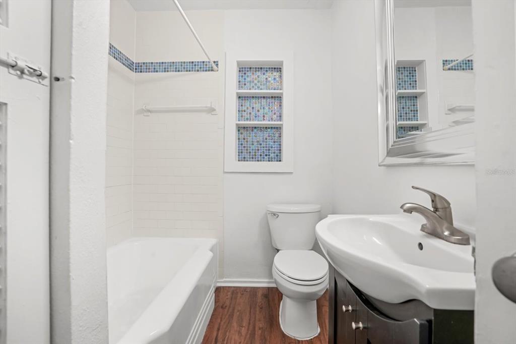 720 West Webster Avenue Winter Park, FL 32789 - Photo 17 of 22 a white toilet sitting next to a bathroom sink