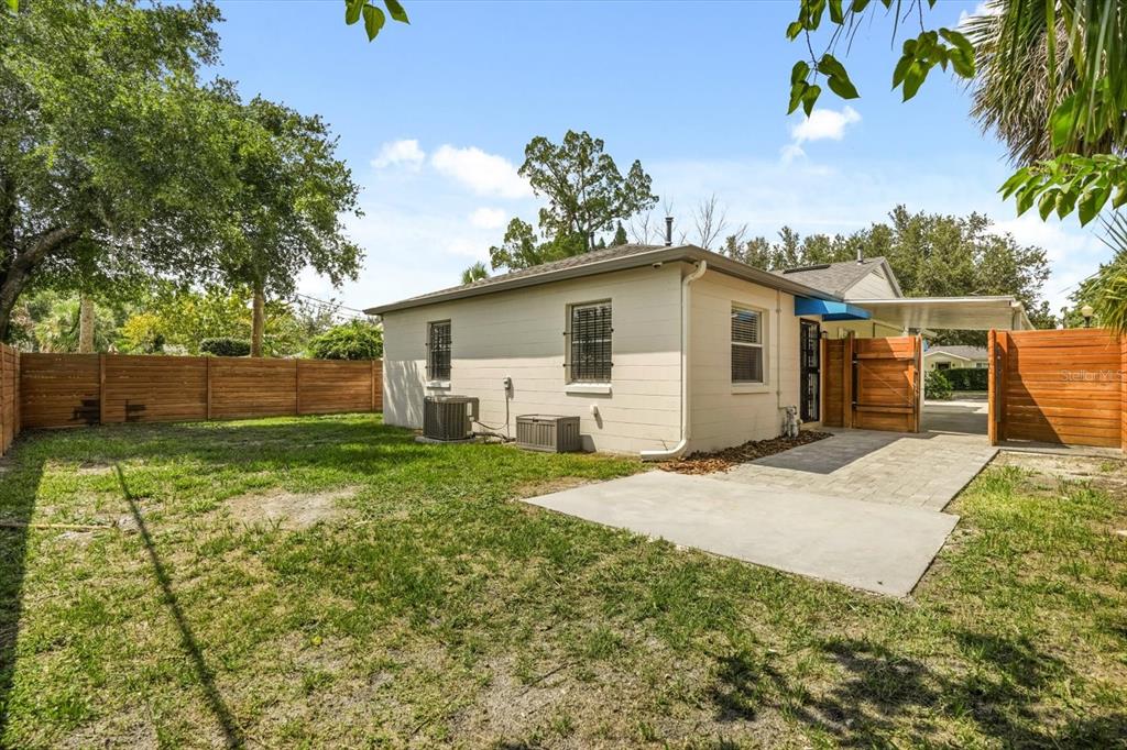 720 West Webster Avenue Winter Park, FL 32789 - Photo 18 of 22 a white house that has a tree in front of it