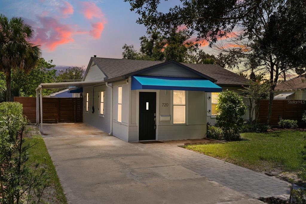 720 West Webster Avenue Winter Park, FL 32789 - Photo 2 of 22 a front view of a house with garden
