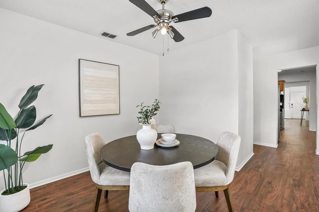 720 West Webster Avenue Winter Park, FL 32789 - Photo 6 of 22 a dining room with furniture potted plants and wooden floor