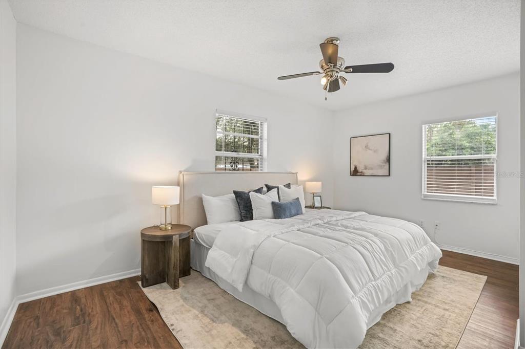 720 West Webster Avenue Winter Park, FL 32789 - Photo 8 of 22 a bedroom with a bed and a night stand