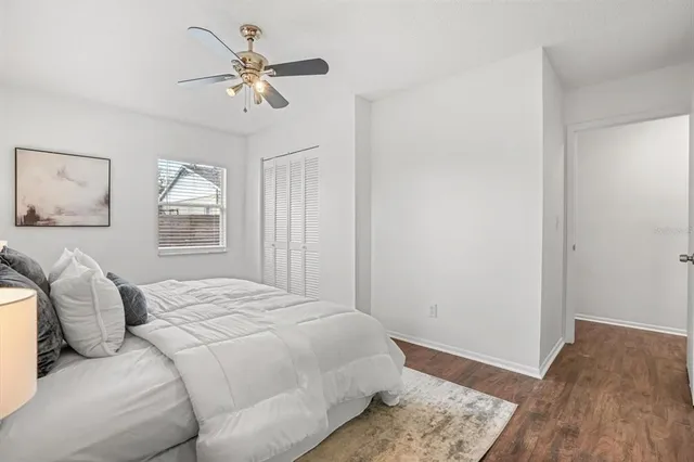 a bedroom with a bed and window