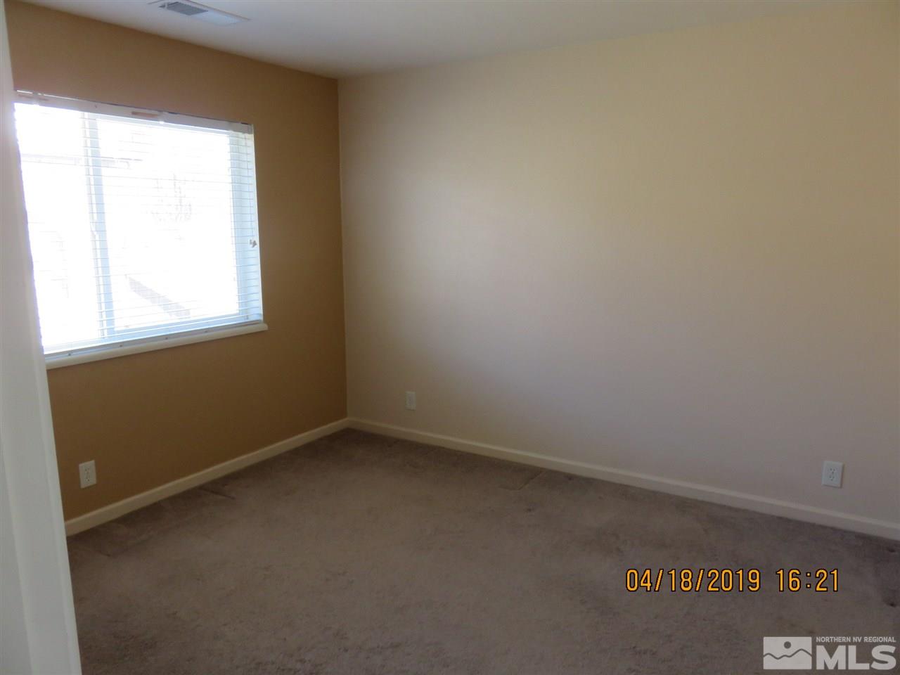 591 Tarn Way Reno, NV 89503 - Photo 4 of 8 an empty room with a window