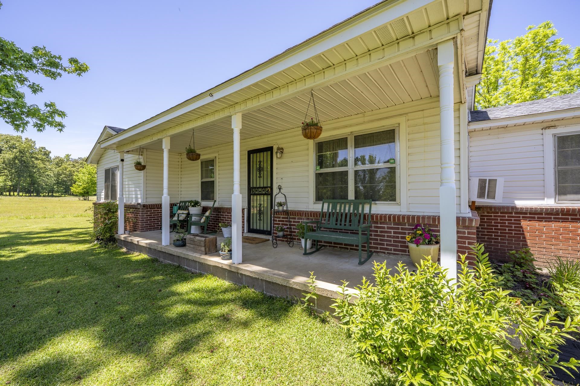 2884 Sandy Flat Road Bethel Springs, TN 38315 - Photo 11 of 40 a view of a house with backyard sitting area and garden