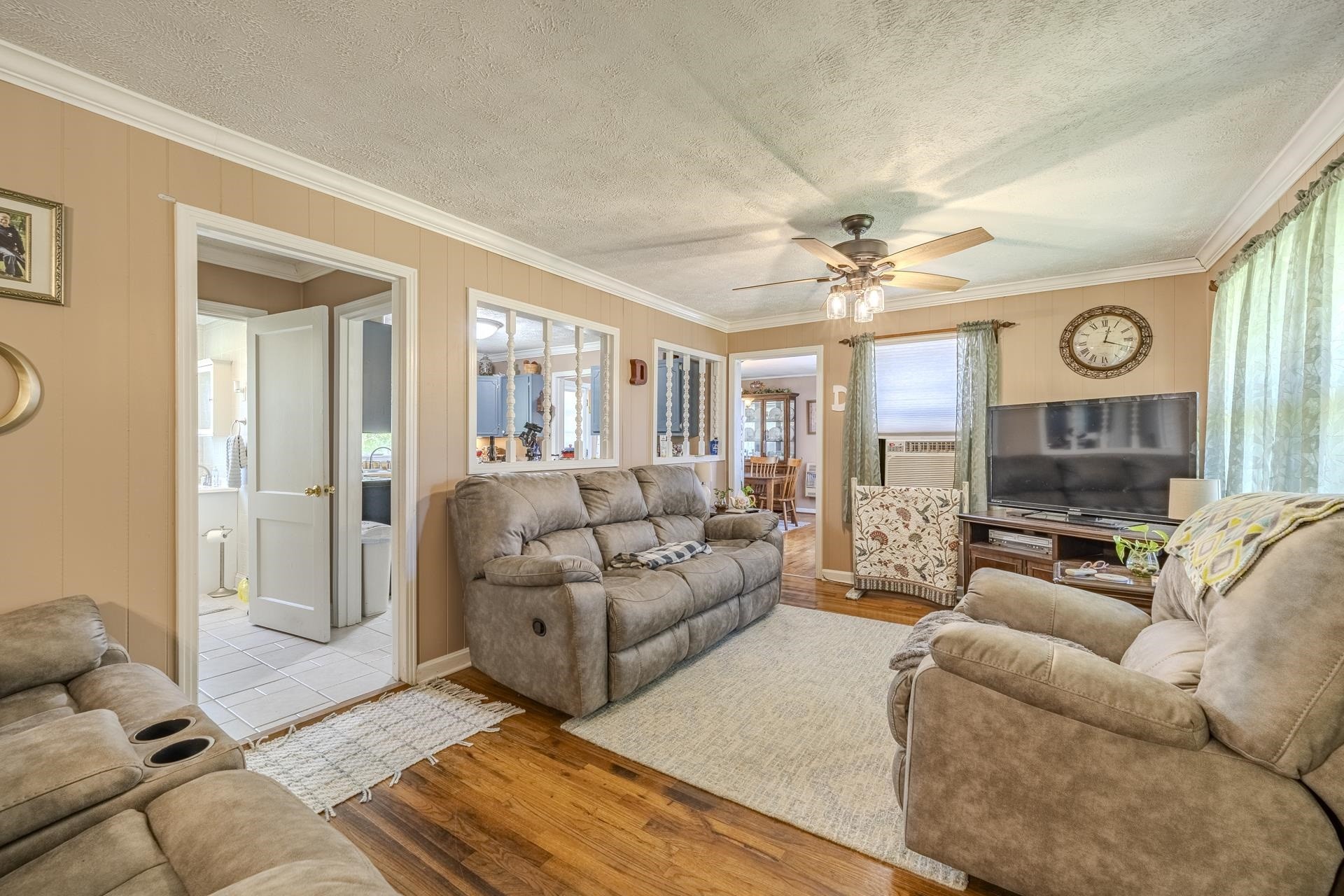 2884 Sandy Flat Road Bethel Springs, TN 38315 - Photo 12 of 40 a living room with furniture a large window and a flat screen tv