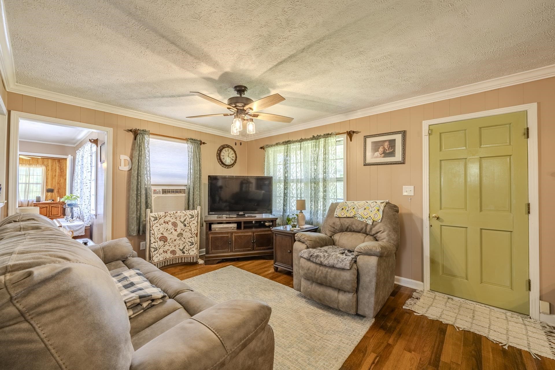 2884 Sandy Flat Road Bethel Springs, TN 38315 - Photo 13 of 40 a living room with furniture a flat screen tv and a large window