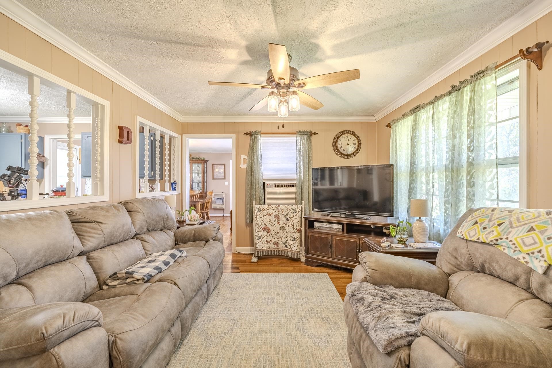 2884 Sandy Flat Road Bethel Springs, TN 38315 - Photo 14 of 40 a living room with furniture a large window and a flat screen tv