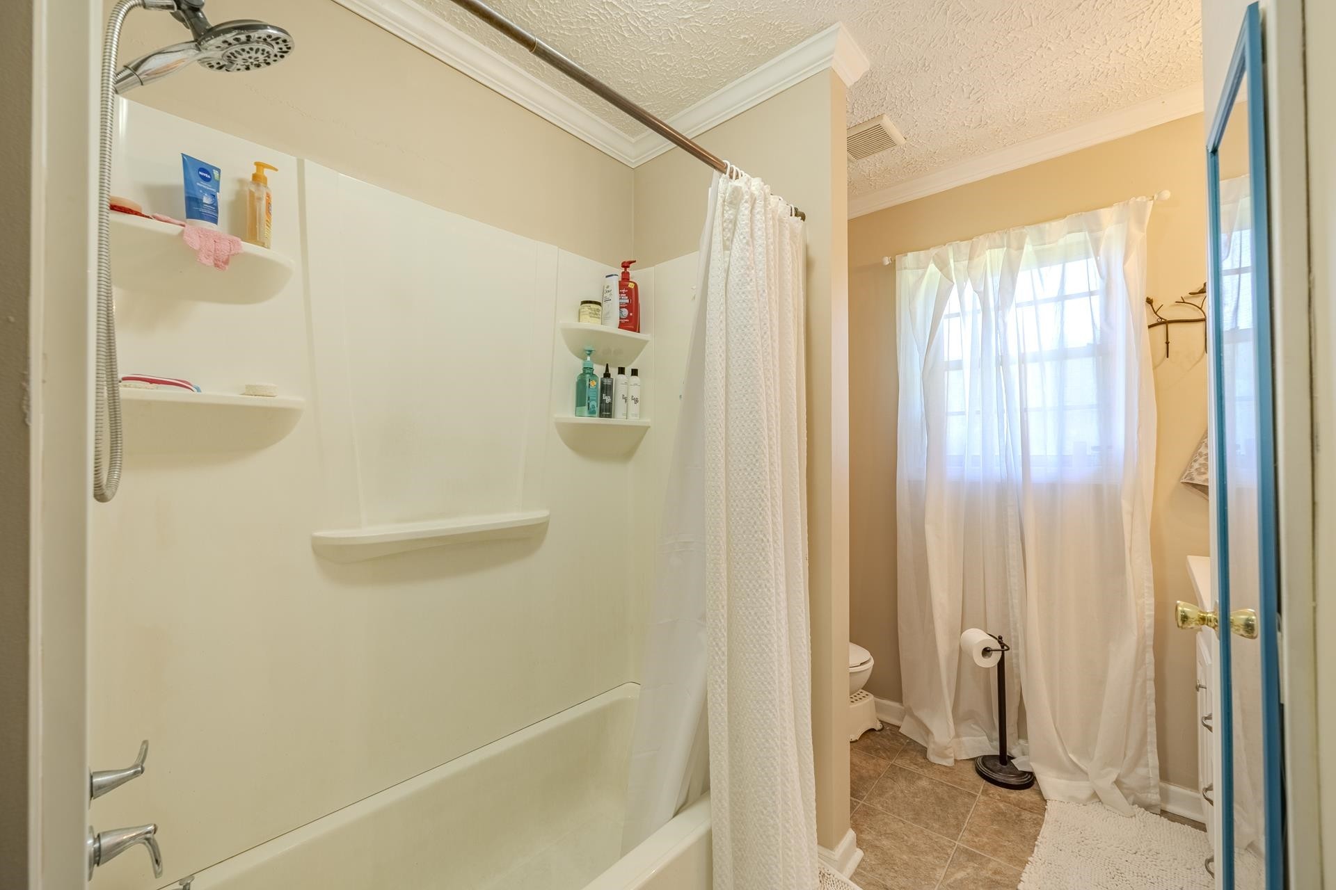 2884 Sandy Flat Road Bethel Springs, TN 38315 - Photo 27 of 40 a bathroom with a shower and a tub