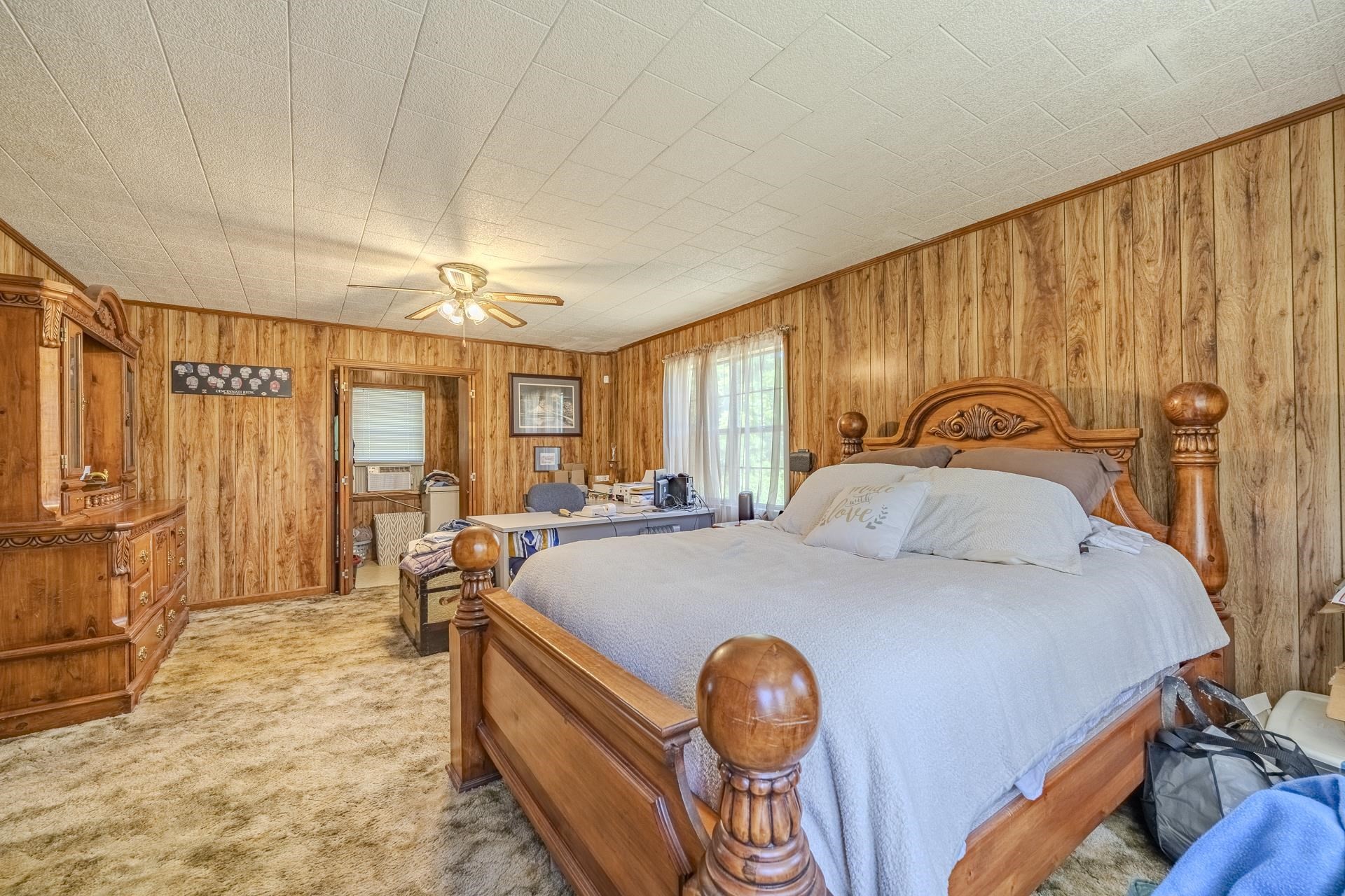 2884 Sandy Flat Road Bethel Springs, TN 38315 - Photo 33 of 40 a bed sitting in a room next to a window