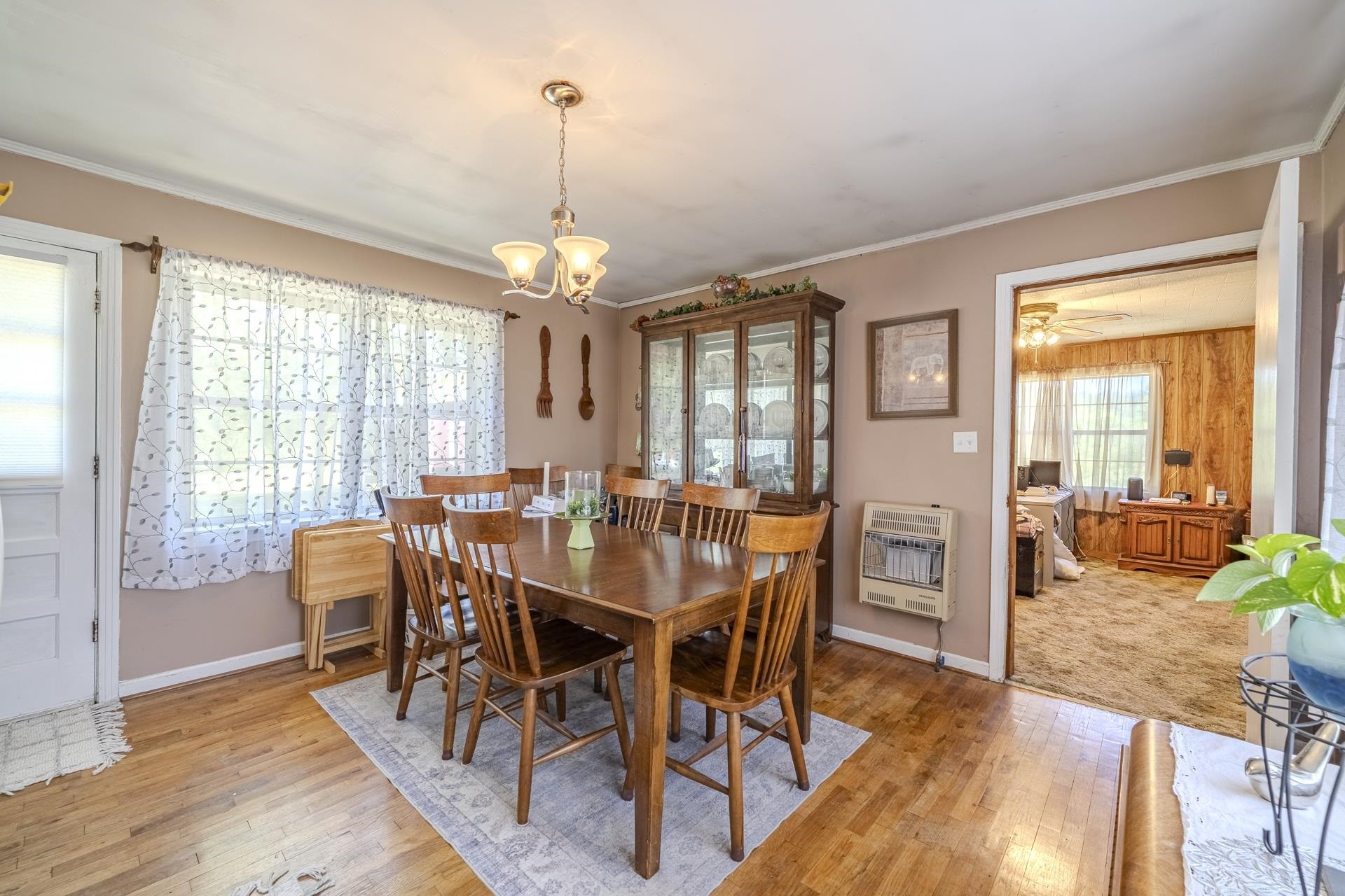 2884 Sandy Flat Road Bethel Springs, TN 38315 - Photo 6 of 40 a view of a dining room with furniture window and wooden floor