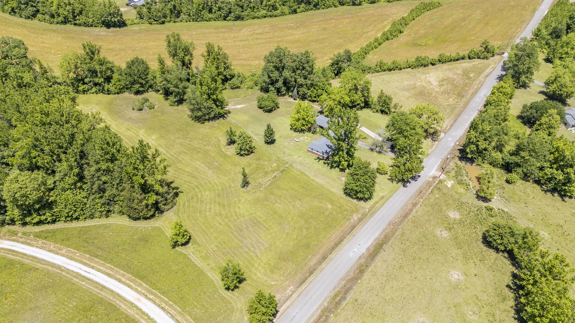 2884 Sandy Flat Road Bethel Springs, TN 38315 - Photo 7 of 40 a view of a swimming pool and a lake