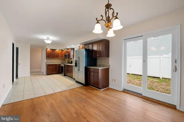 a view of a kitchen with a sink cabinet and a living room