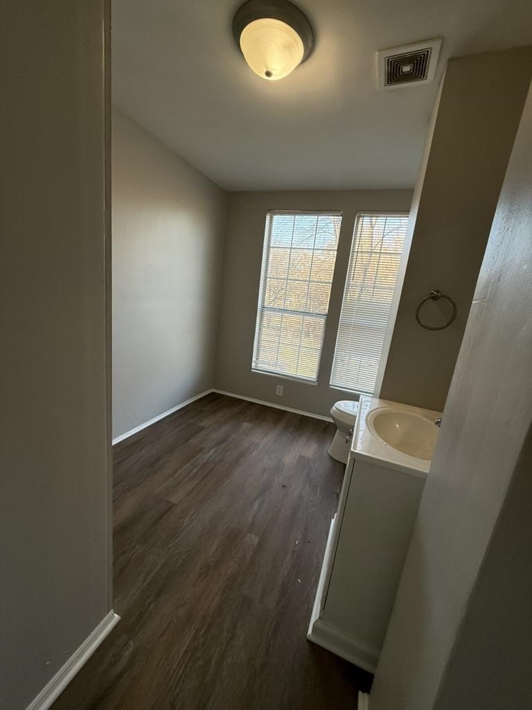 994 Hale Road Memphis, TN 38116 - Photo 14 of 24 Bathroom featuring vanity and dark wood-style floors