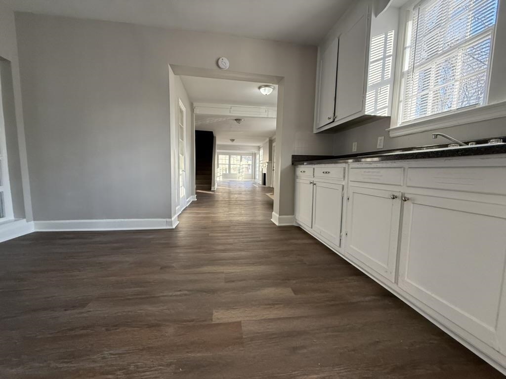 994 Hale Road Memphis, TN 38116 - Photo 2 of 24 Kitchen featuring dark countertops, white cabinets, and dark wood finished floors