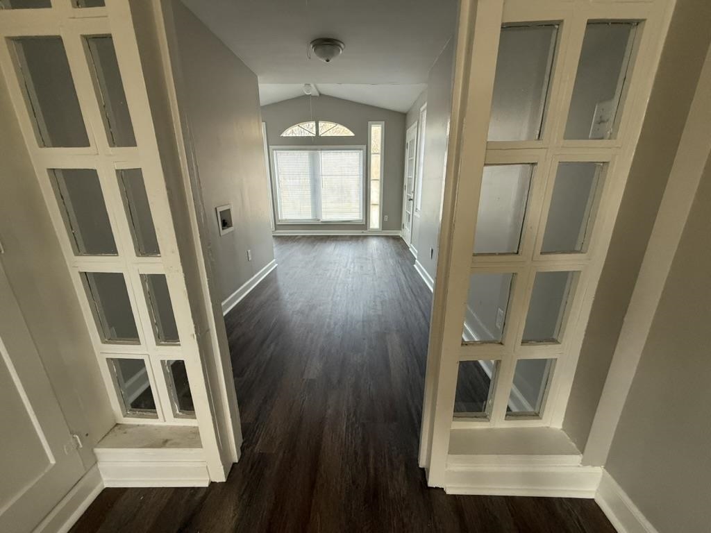 994 Hale Road Memphis, TN 38116 - Photo 5 of 24 Hallway with vaulted ceiling and dark wood-style flooring