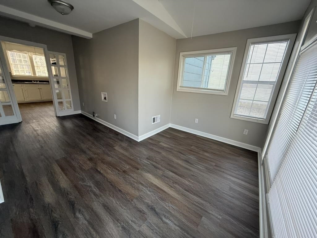 994 Hale Road Memphis, TN 38116 - Photo 6 of 24 Unfurnished room with healthy amount of natural light and dark wood-style floors