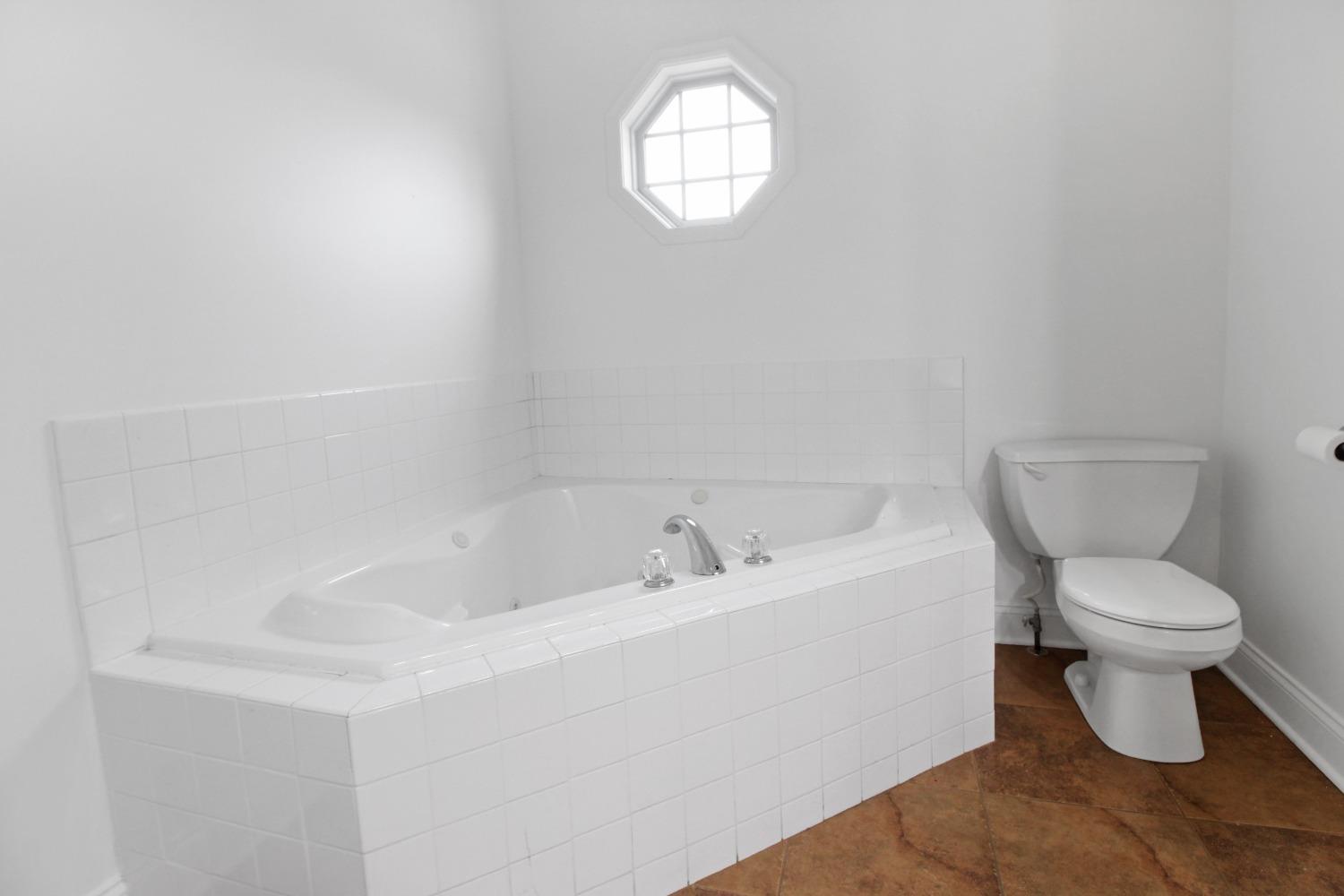 12465 Shelby Place Crown Point, IN 46307 - Photo 18 of 25 a bathroom with a toilet a sink and a mirror
