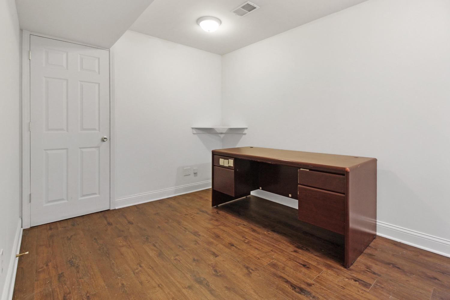 12465 Shelby Place Crown Point, IN 46307 - Photo 23 of 25 a room with wooden floor and furniture