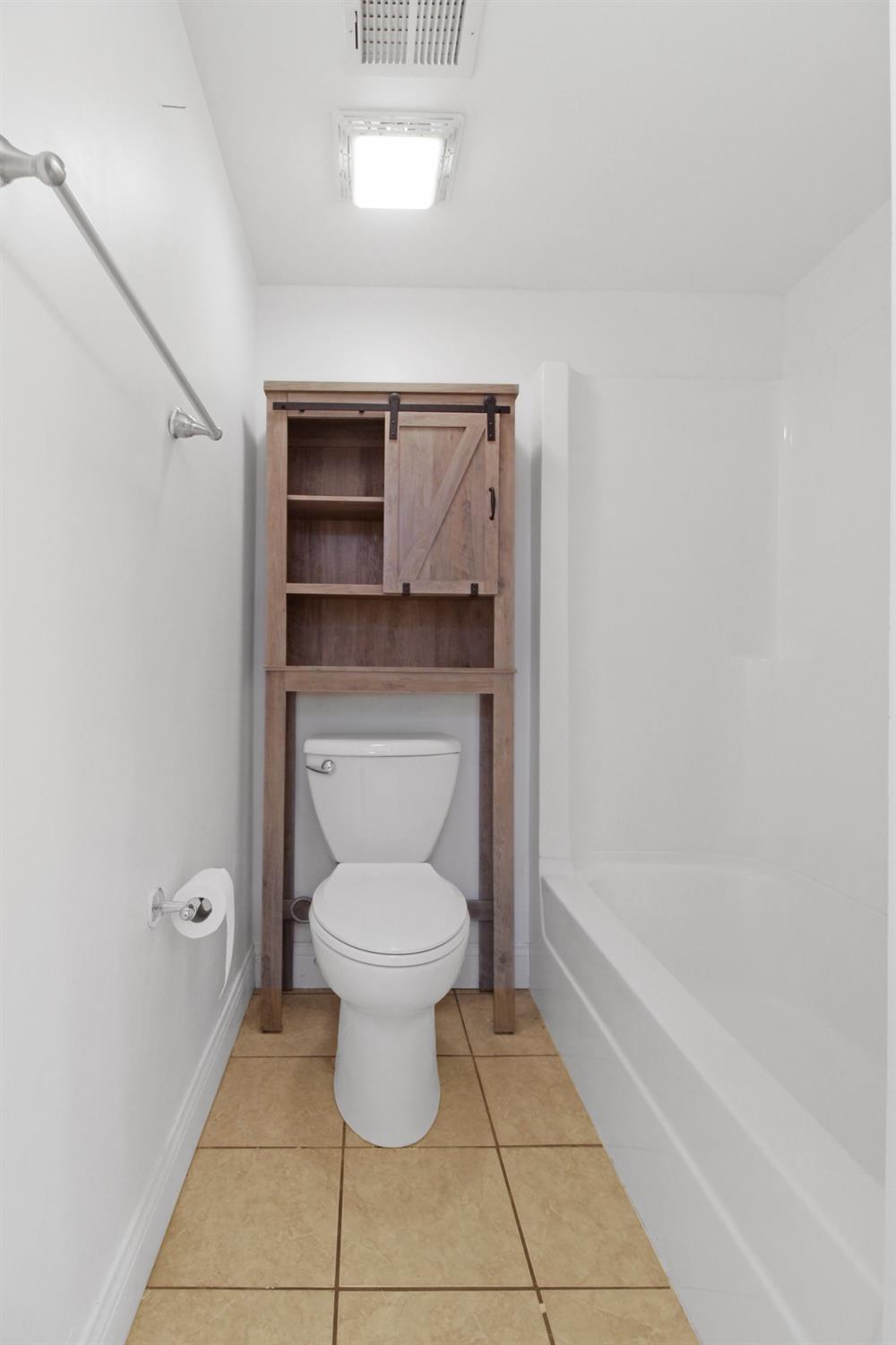 12465 Shelby Place Crown Point, IN 46307 - Photo 25 of 25 a bathroom with a toilet and a bathtub