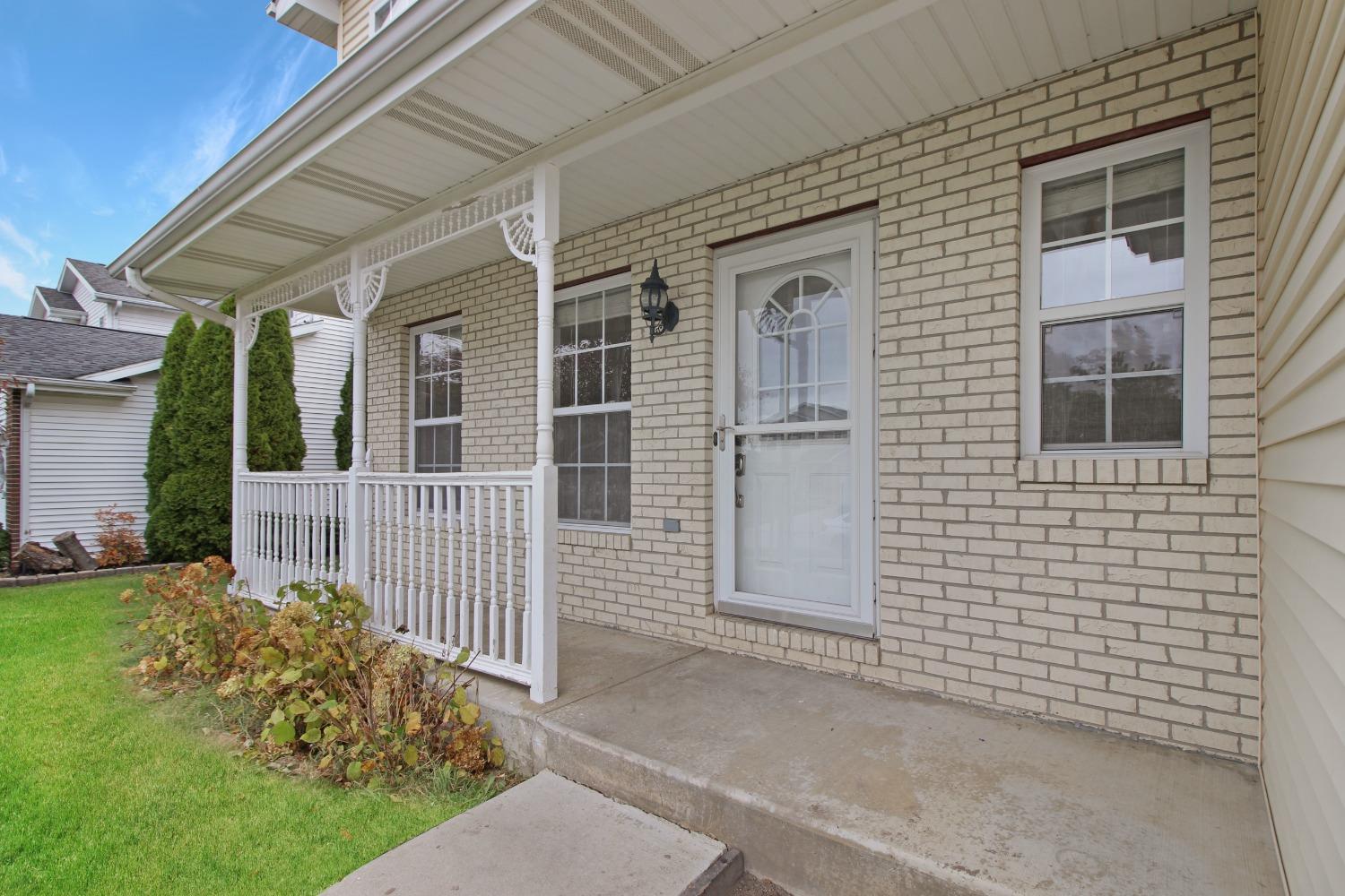 12465 Shelby Place Crown Point, IN 46307 - Photo 3 of 25 a view of a house with a small yard and wooden fence