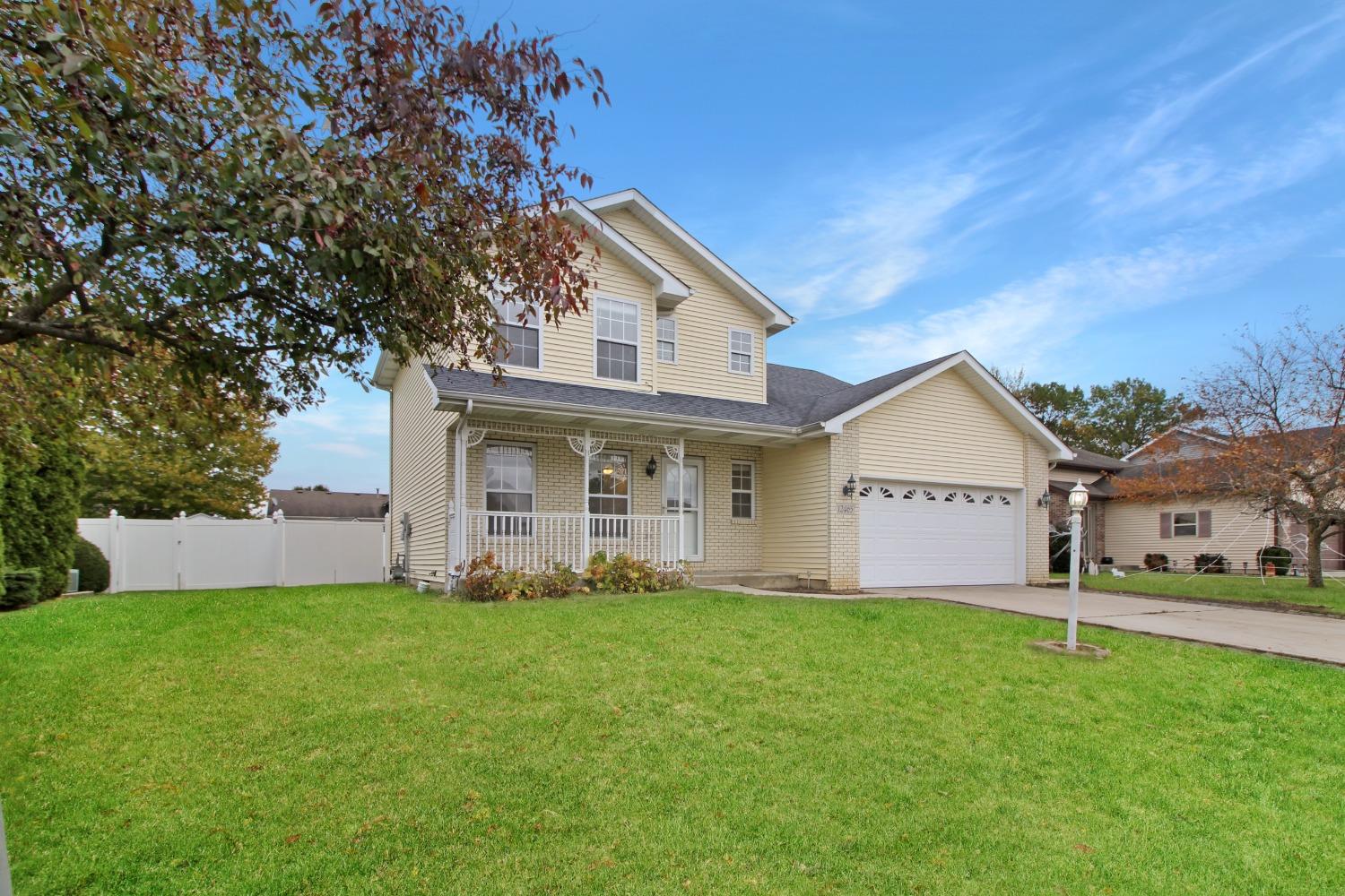 12465 Shelby Place Crown Point, IN 46307 - Photo 5 of 25 a front view of a house with a yard and trees