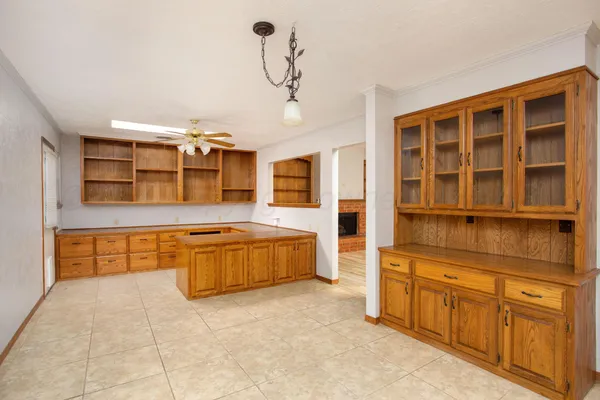 a kitchen with stainless steel appliances granite countertop a stove and cabinets