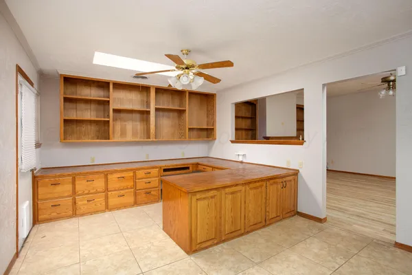 a view of a kitchen with a sink and a microwave