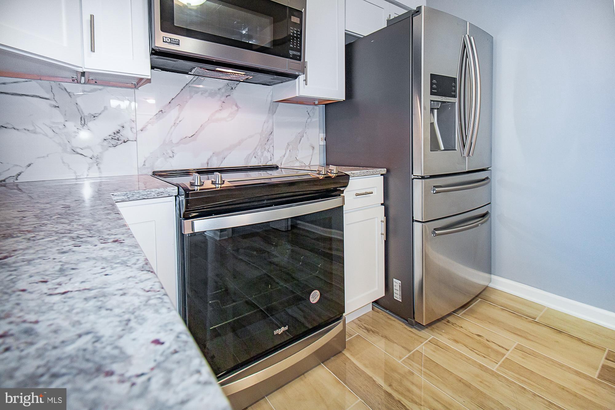 5505 Seminary Road, Unit 1003N Falls Church, VA 22041 - Photo 7 of 27 Expansive Granite countertops. Custom back splash.