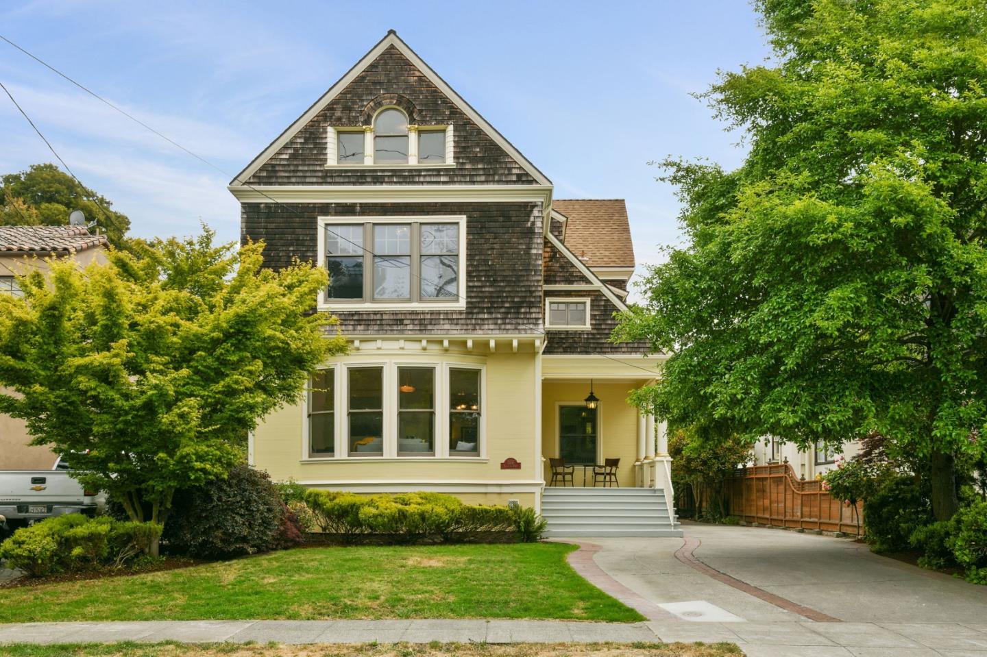 a front view of a house with a yard