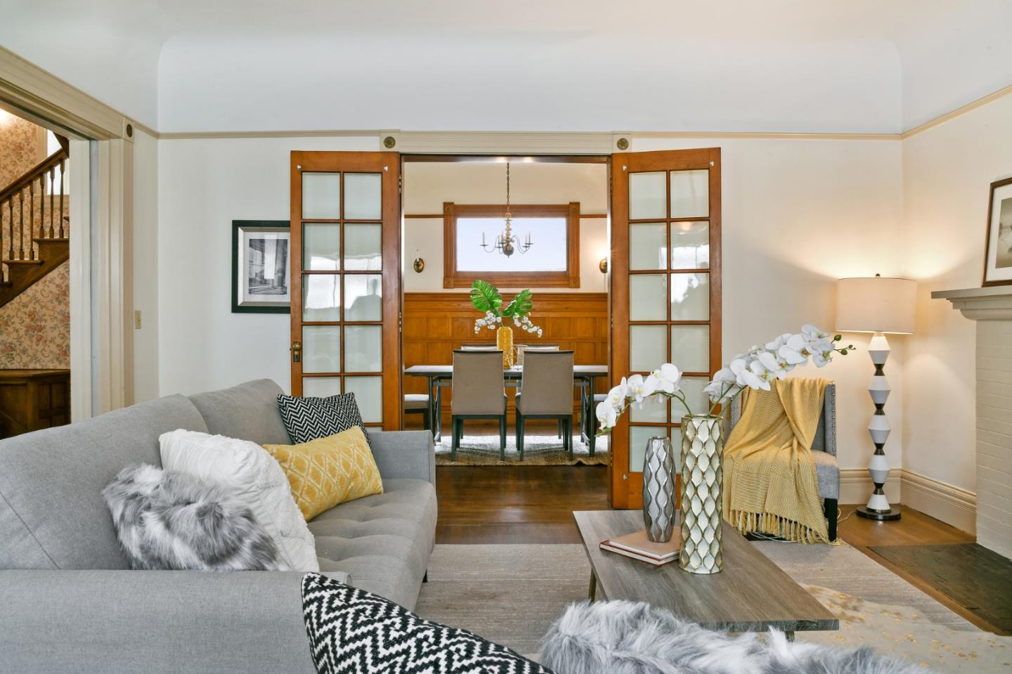 1106 Grand Street Alameda, CA 94501 - Photo 25 of 100 a living room with furniture and floor to ceiling windows