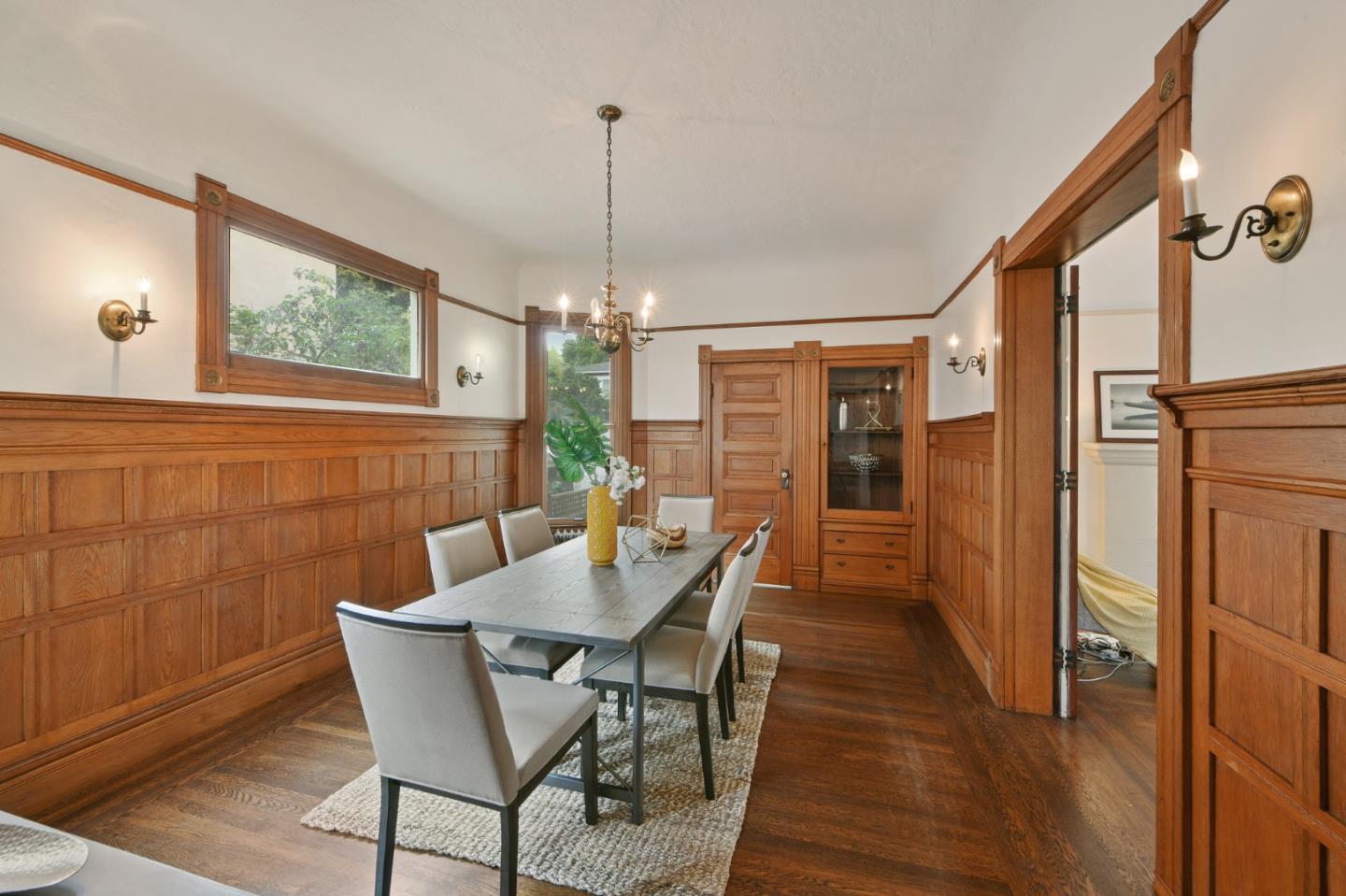 1106 Grand Street Alameda, CA 94501 - Photo 27 of 100 a view of a dining room with furniture window and wooden floor