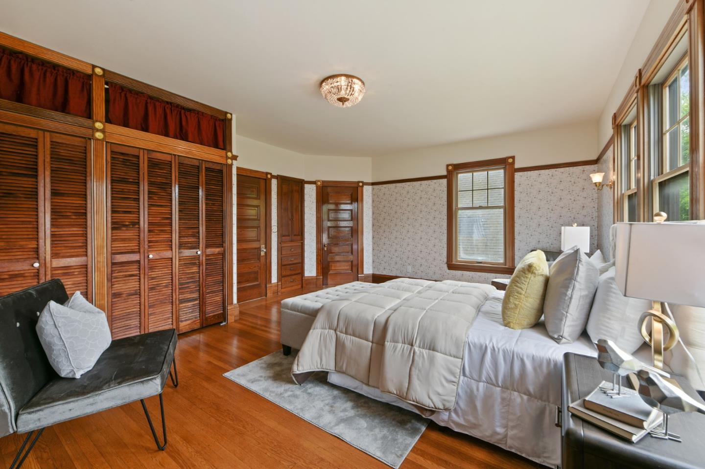 1106 Grand Street Alameda, CA 94501 - Photo 52 of 100 a bedroom with a bed and wooden floor