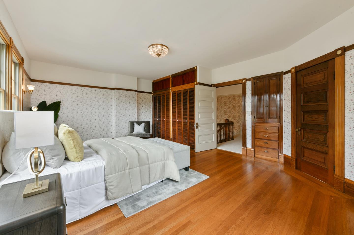 1106 Grand Street Alameda, CA 94501 - Photo 53 of 100 a spacious bedroom with a bed and a walk in closet
