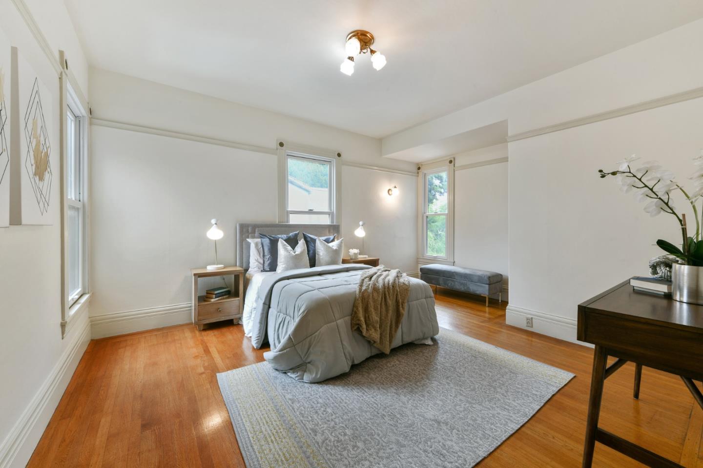 1106 Grand Street Alameda, CA 94501 - Photo 58 of 100 a bedroom with a bed and a table in it