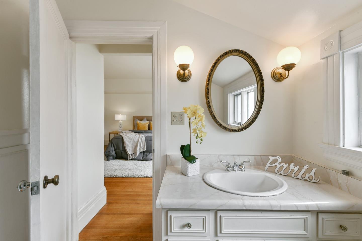 1106 Grand Street Alameda, CA 94501 - Photo 63 of 100 a en suite bathroom with a double vanity sink and a mirror