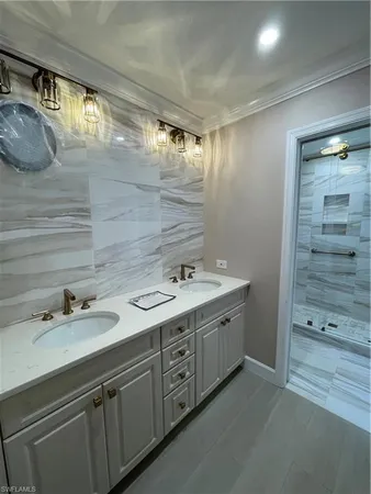 a bathroom with a double vanity sink and mirror