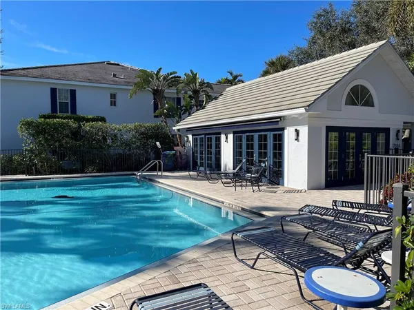 a view of a house with backyard sitting area and garden