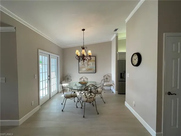 a view of a dining room with furniture and window