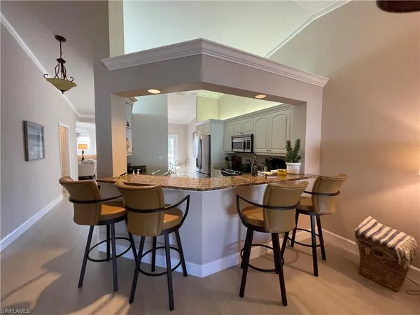 a dining room with a table and chairs