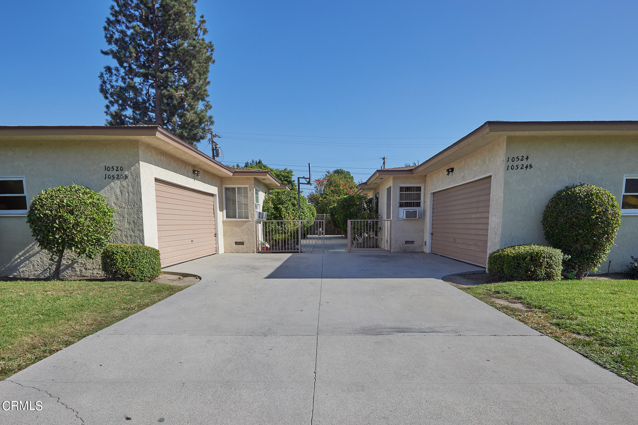 10520 Myrtle Street Downey, CA 90241 - Photo 1 of 8 a front view of a house with garden