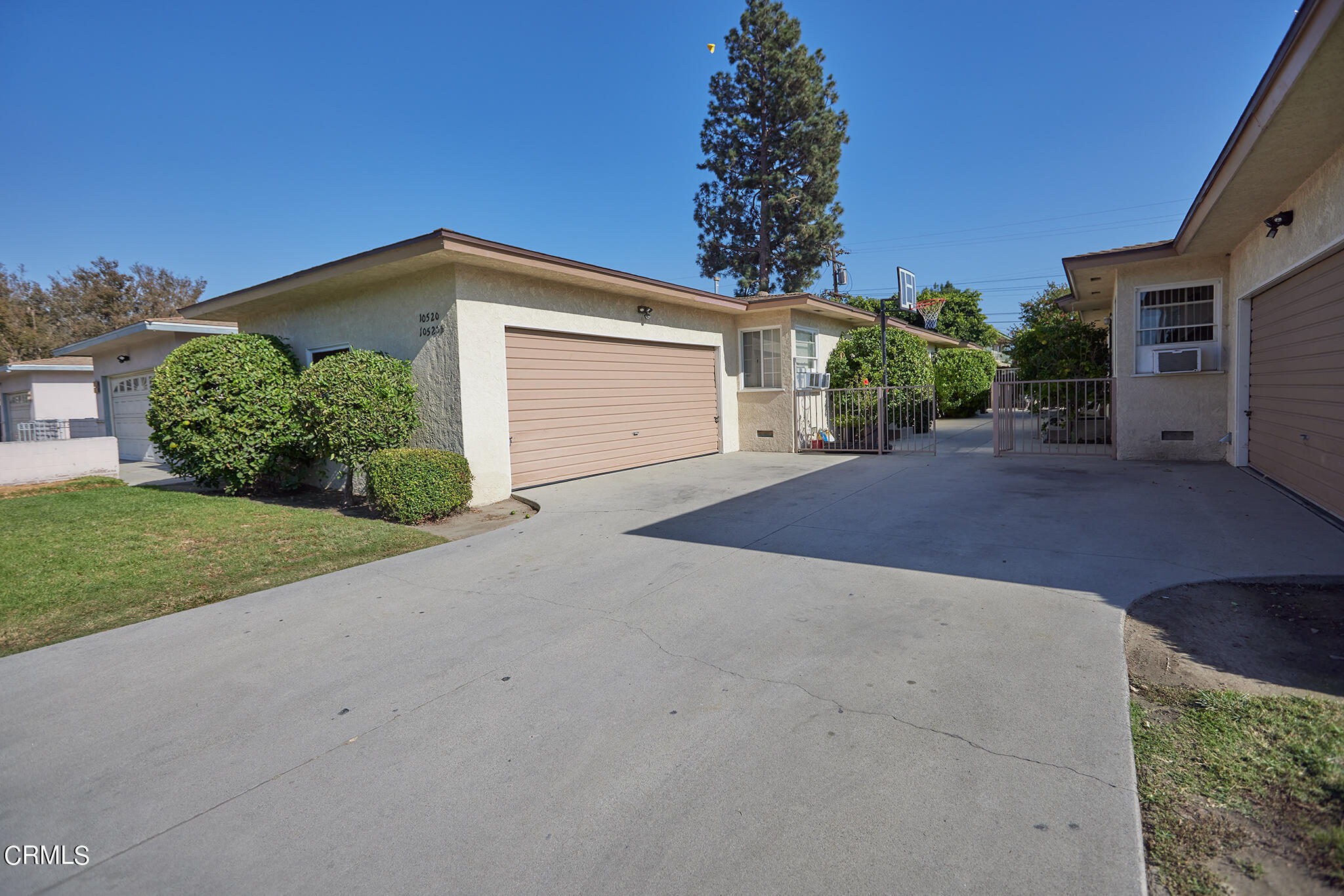 10520 Myrtle Street Downey, CA 90241 - Photo 3 of 8 a front view of a house with a yard and garage