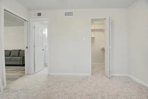 a view of empty room with cabinet and cabinet