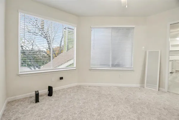 a view of a hallway with wooden shelves
