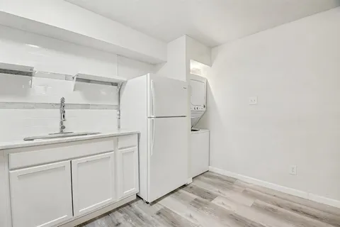 a bathroom with a sink a toilet and bathtub
