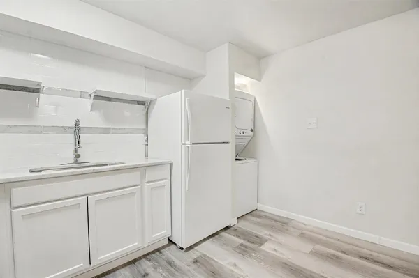 a bathroom with a sink a toilet and bathtub