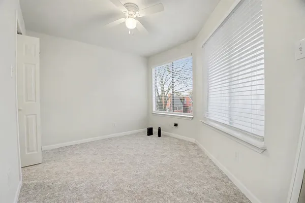 a view of livingroom with furniture and window