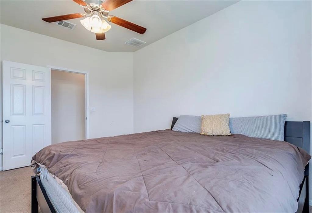 104 Beech Creek Lane Leander, TX 78641 - Photo 9 of 13 Carpeted bedroom featuring ceiling fan