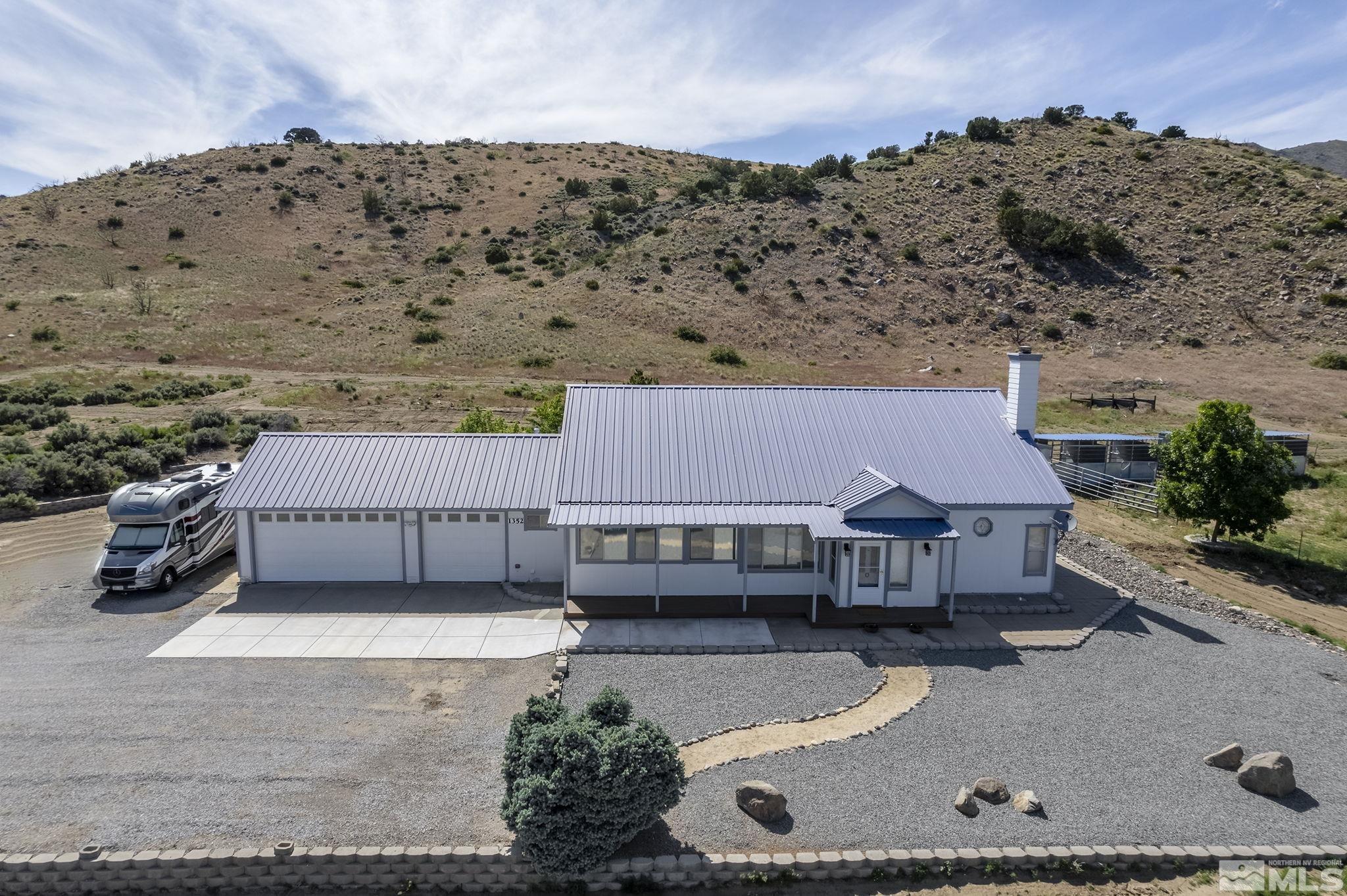 1352 Antelope Valley Road Reno, NV 89506 - Photo 3 of 36 an aerial view of a house with swimming pool and large trees
