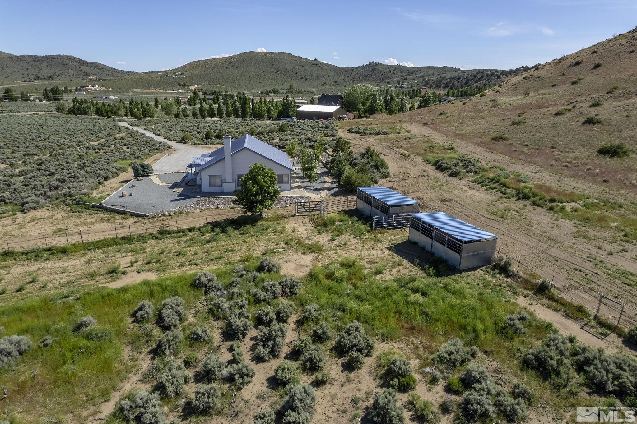 1352 Antelope Valley Road Reno, NV 89506 - Photo 35 of 36 a view of a lush green hillside and houses